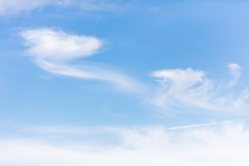 White clouds on a blue sky as background