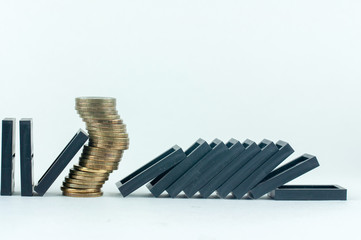 coins and dominoes, the concept of the financial crisis