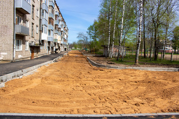 Repair of asphalt in the yard of an apartment building. Renovation of the road. The details of the repair of asphalt roads.
