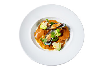 Italian dish with pasta, broccoli and seafood. On white background.