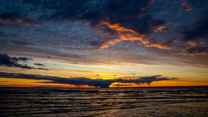 Sunset on the beach, dramatic sky, dramatic clouds.