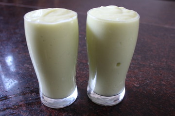 Close up of avocado juice in a glass