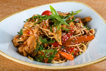 Noodles with chicken, soy and oyster sauce, sesame oil, ginger, garlic, fresh coriander leaves.