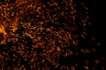 flame of fire with sparks on a black background