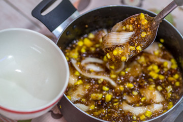 A blurry abstract background of a healthy dessert menu (sago from natural trees), bring to heat and add coconut milk, corn together, moderately sweet taste