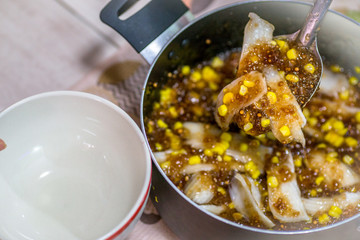 A blurry abstract background of a healthy dessert menu (sago from natural trees), bring to heat and add coconut milk, corn together, moderately sweet taste