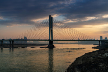 Fototapeta na wymiar Cable stayed bridge at sunset