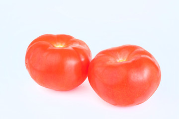 Red fresh tomatoes close-up isolated on a white background. Fresh vegetables. Harvest tomatoes.