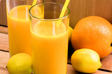 Orange juice in a glass with a straw. Nectar of fruit. Cocktail.