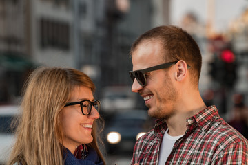 Happy smiley couple enjoying on the street.