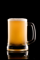glass of beer on black