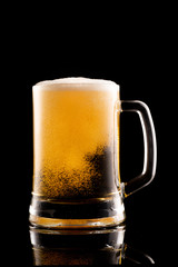 glass of beer on black background
