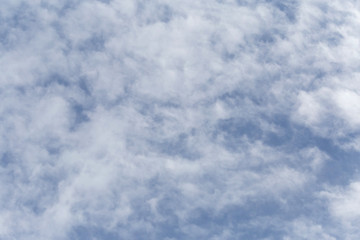 abstract natural background: altocumulus clouds in a blue sky