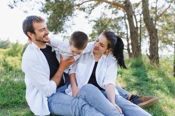 parents and child on vacation playing together outdoor