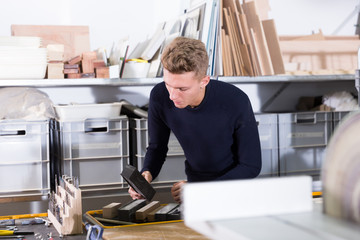 Young man working on architectural model