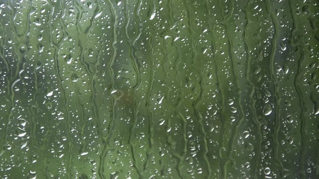 Heavy rain storm into the window, weather concept
