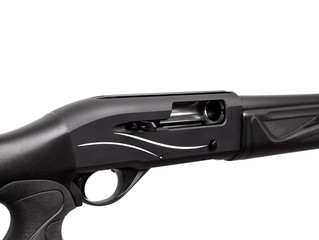 Modern semi-automatic tactical shotgun isolate on white back. Smoothbore weapons for sports, hunting and self-defense.