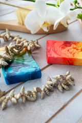 Natural colorful handmade soap on wooden table, spa set