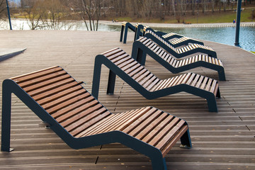 Sun loungers  on platform on lake