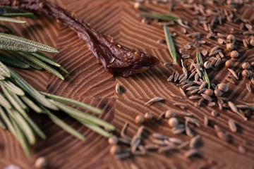 Close-up of a piece of meat on a wooden Board with spices. Restaurant menu, a series of photos of different dishes