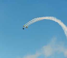 Airplanes on airshow. Aerobatic team performs flight at air show