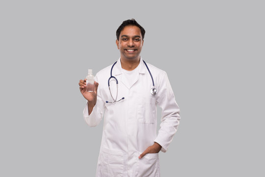 Indian Man Doctor Holding Hands Sanitizer. Hands Wash Antiseptic. Corona Virus Concept. Isolated