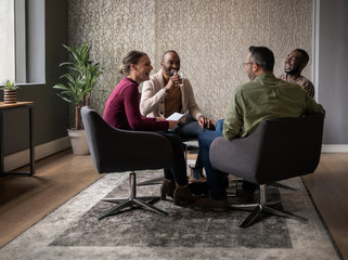 Diverse group of smiling businesspeople having a casual meeting