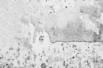 Texture of a concrete wall with cracks and scratches which can be used as a background