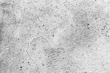 Texture of a concrete wall with cracks and scratches which can be used as a background
