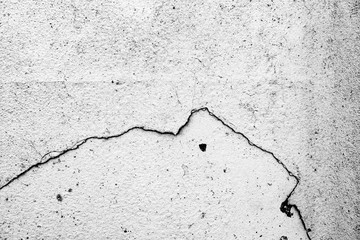 Texture of a concrete wall with cracks and scratches which can be used as a background