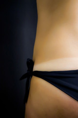 detail of model`s body before and after applying airbrush tan treatment in beauty salon. fake tan on woman`s body