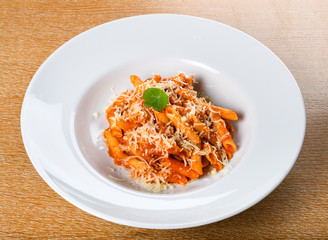 Italian spicy penne arrabiata or pasta al'arrabiata. Arrabbiata sauce is a spicy sauce for pasta