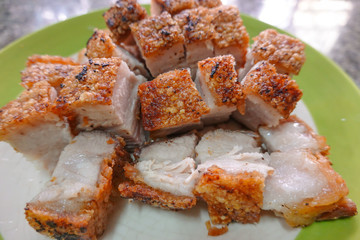 traditional Thai culture air fryer fried pork cuisine style or moo tod krob favorite famous street fast foods menu at thailand homemade
with hot spicy sauces on table wood dish sticky rice vegetable