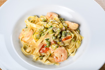 Italian tagliatelle with asparagus and shrimps or scampi, dill cream sauce.Fresh Food Dining Eating