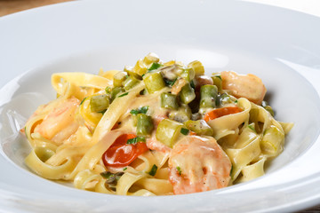 Italian tagliatelle with asparagus and shrimps or scampi, dill cream sauce.Fresh Food Dining Eating