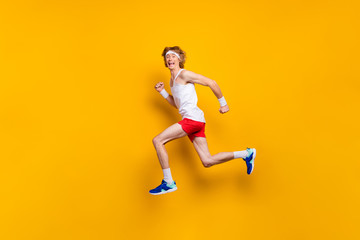 Full length body size view of nice funky glad excited cheerful cheery motivated guy jumping running...