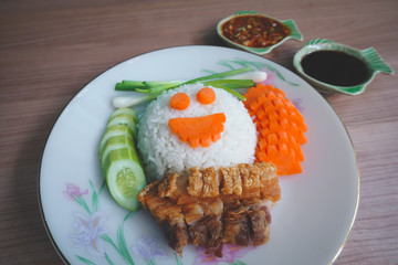 traditional Thai culture air fryer fried pork cuisine style or moo tod krob favorite famous street fast foods menu at thailand homemade
with hot spicy sauces on table wood dish sticky rice vegetable