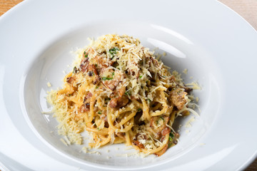 Spaghetti carbonara, specific authentic traditional italian: bacon, egg, parmesan shavings