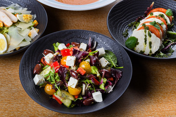 Greek salad or horiatiki salad is a salad in Greek cuisine. Greek salad is made with tomatoes