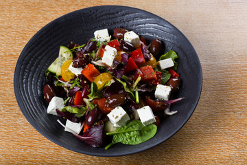 Greek salad or horiatiki salad is a salad in Greek cuisine. Greek salad is made with tomatoes