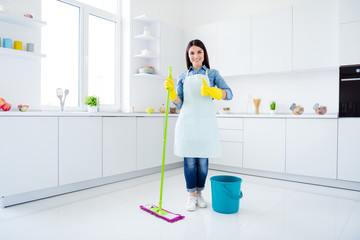 Full length body size view of her she nice attractive lovely cheerful cheery housemaid domestic work wiping neat tidy floor housekeeping showing thumbup in modern light white interior kitchen house