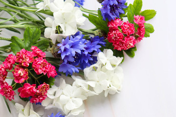 bouquet of colorful flowers on a pink background