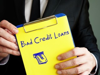 Financial concept about Loan With Bad Credit with phrase on the sheet.
