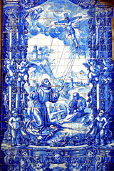 Porto, Portugal - August 17, 2015: Focus the church la Capela das Almas. Its facade is covered with Azulejos. The tiles show the lives of Saint Catherine and Saint Francis of Assisi.