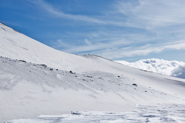Snowy side of a volcano mountain in Sicily