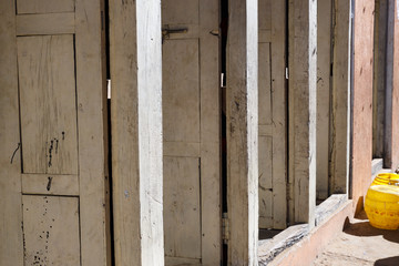 Fototapeta na wymiar Open wooden doors in an old house in Nepal.