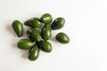 Ripe avocado fruits on a white background. Concept of healthy eating, vegetarianism.