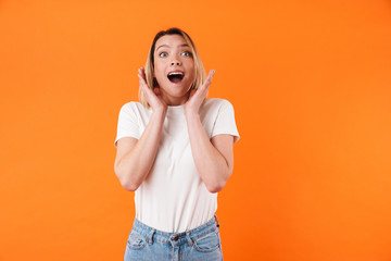 Image of excited caucasian woman expressing surprise on camera