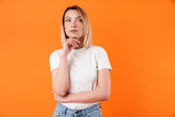 Image of thinking caucasian woman posing and looking aside