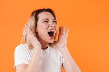 Image of beautiful annoyed woman screaming and looking aside